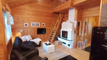 Apartment, 1 Bedroom, Sauna, Courtyard View | Living area | 32-inch flat-screen TV with satellite channels, TV, fireplace