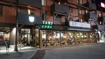 A building with a restaurant named "Camp" and another named "Camp 7".