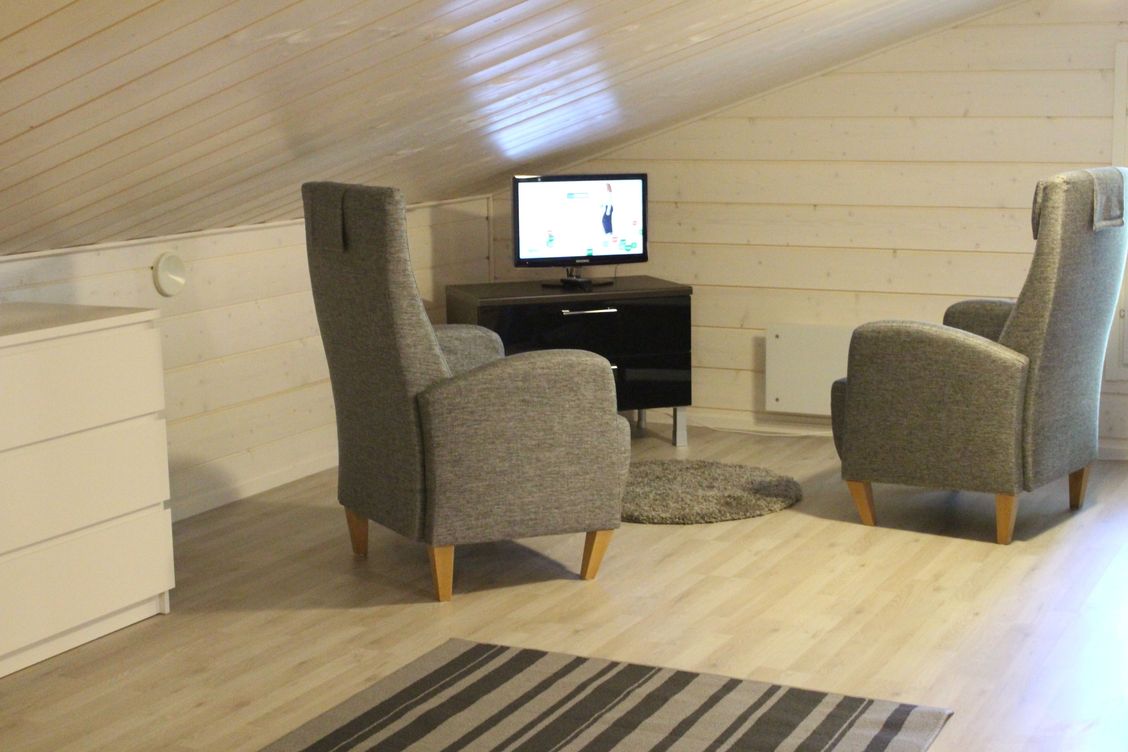 Apartment, 2 Bedrooms, Sauna | Living area | 40-inch flat-screen TV with digital channels, TV, fireplace