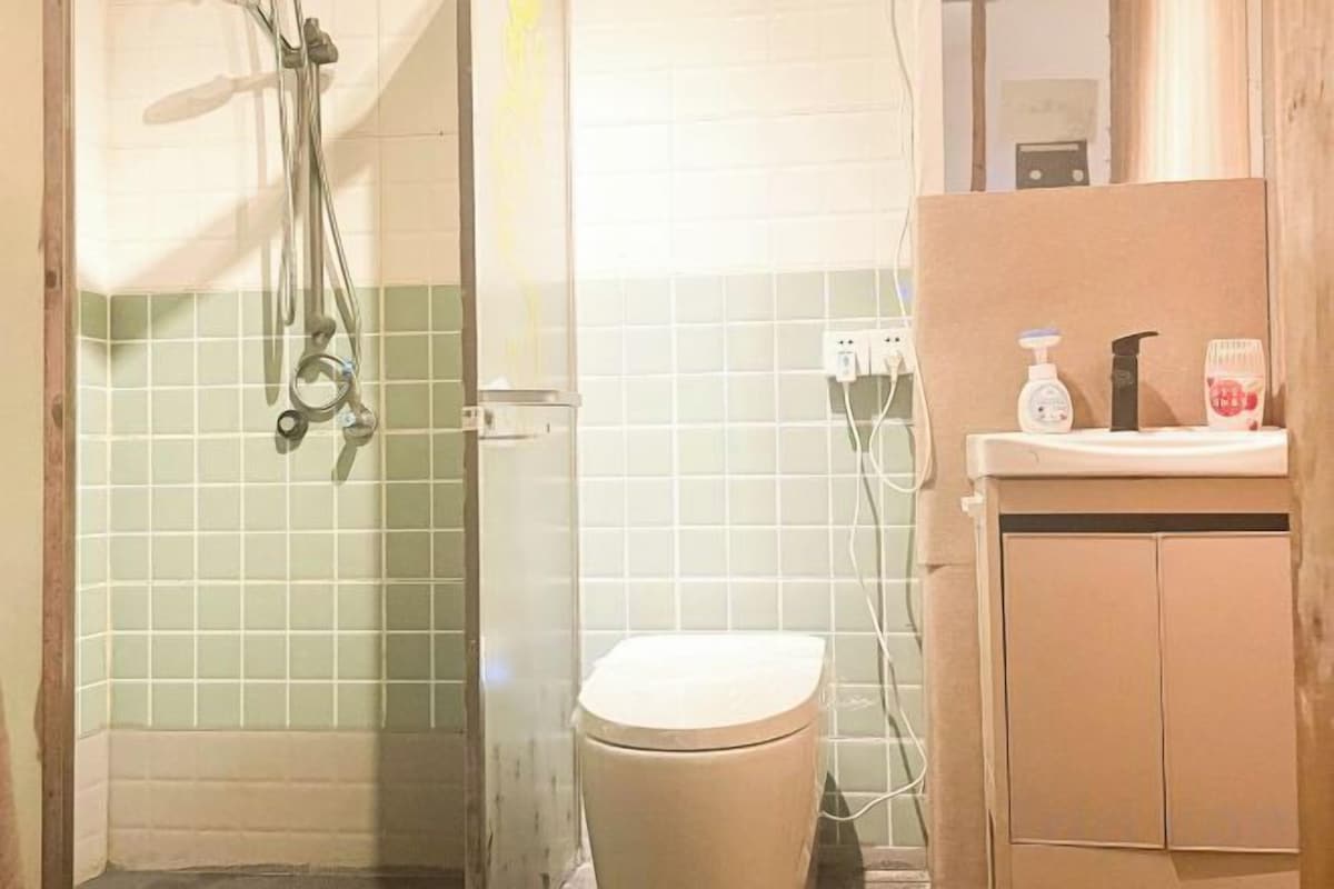 Bathroom | Shower, free toiletries, hair dryer, slippers