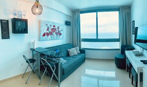 Panoramic Apartment | Living area | Flat-screen TV