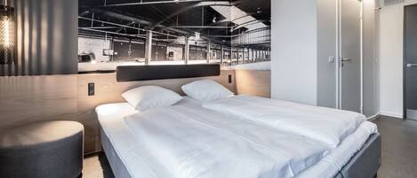 Hypo-allergenic bedding, laptop workspace, blackout drapes