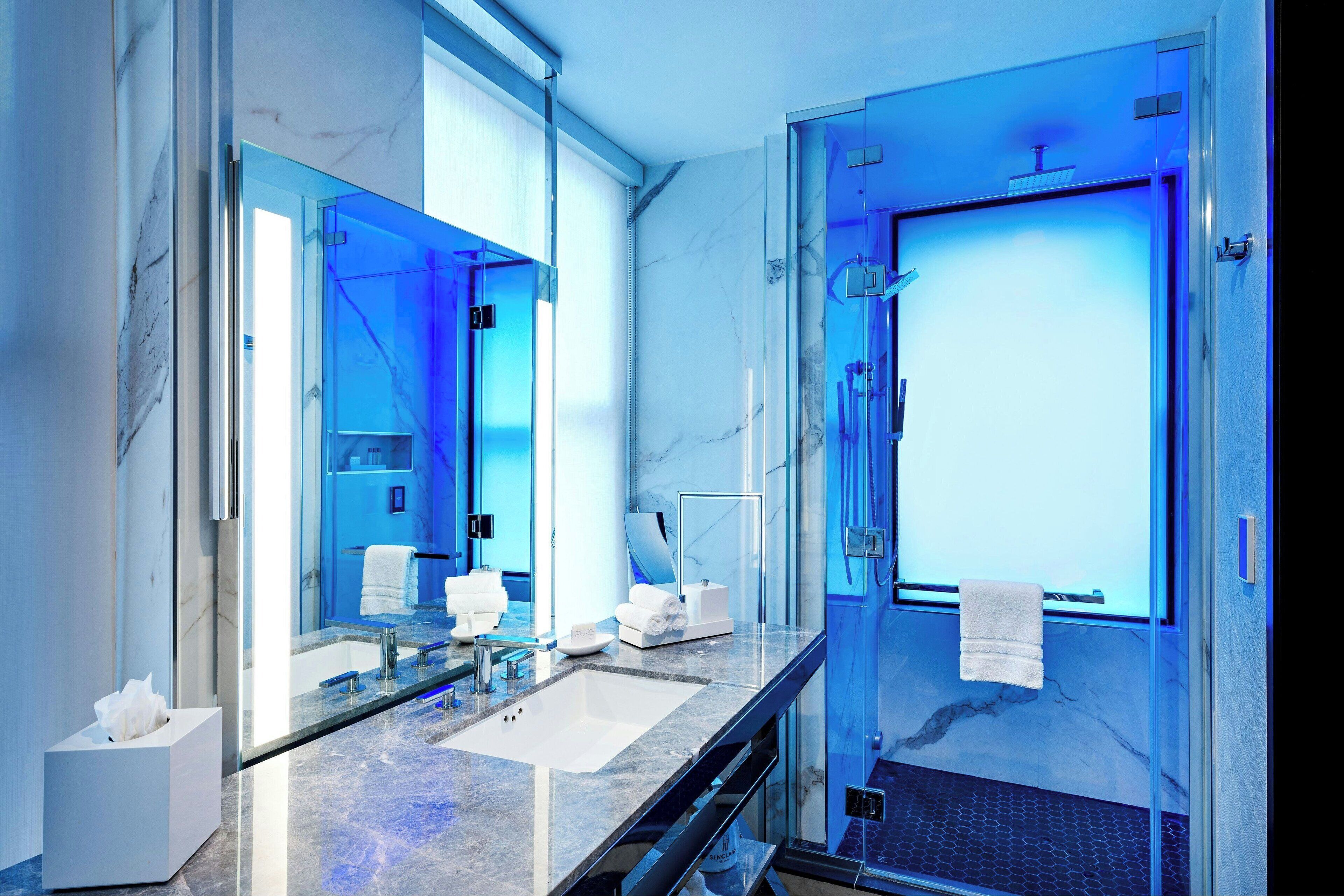 suite, 1 king bed with sofa bed | bathroom | shower, rainfall showerhead, hair dryer, bathrobes