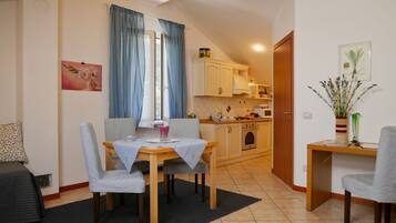 Comfort Apartment, Garden View | Living room | TV