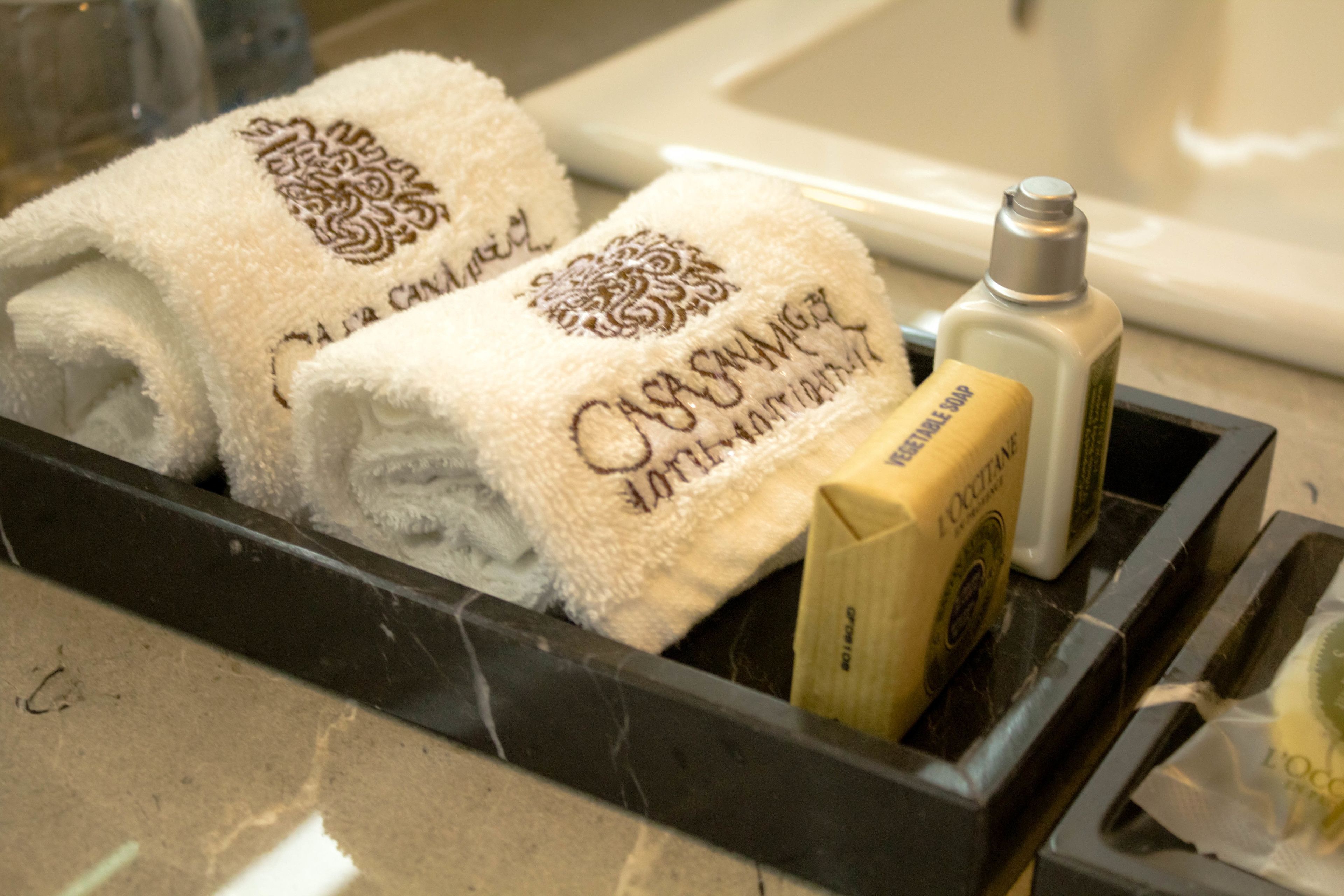 designer toiletries, hair dryer, bathrobes, slippers