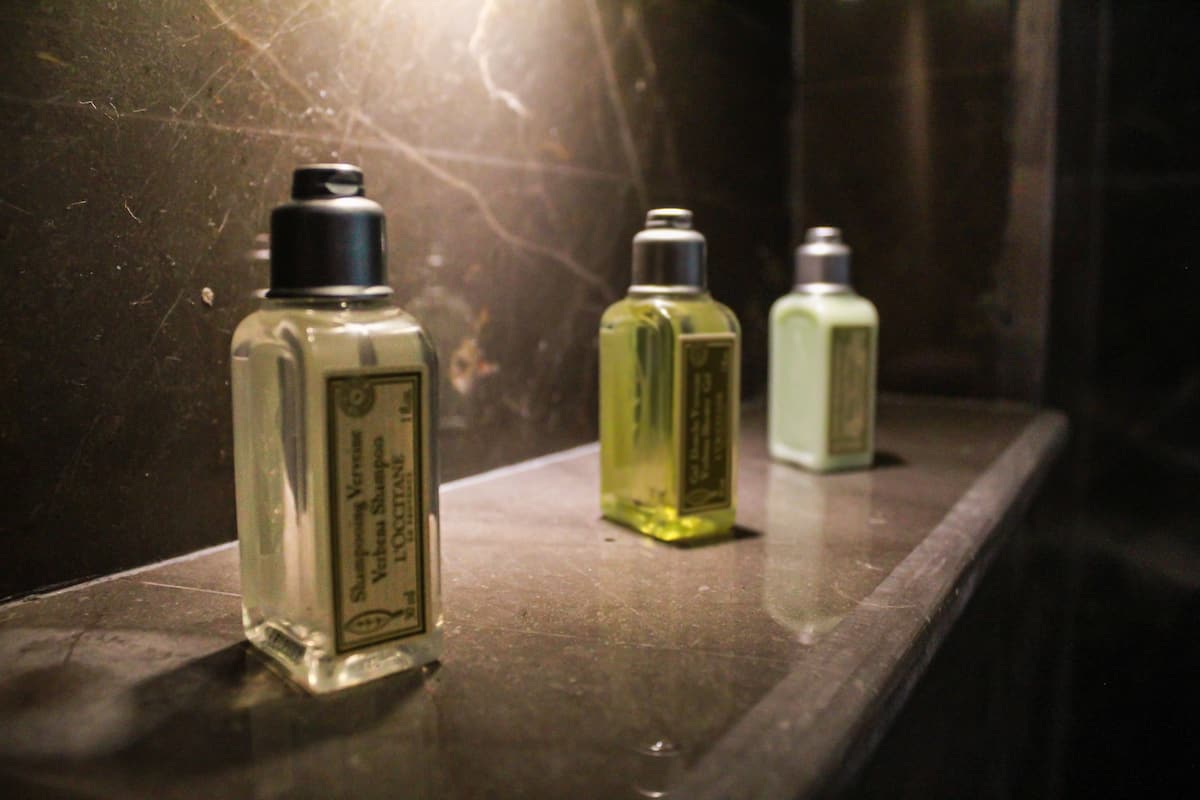 designer toiletries, hair dryer, bathrobes, slippers