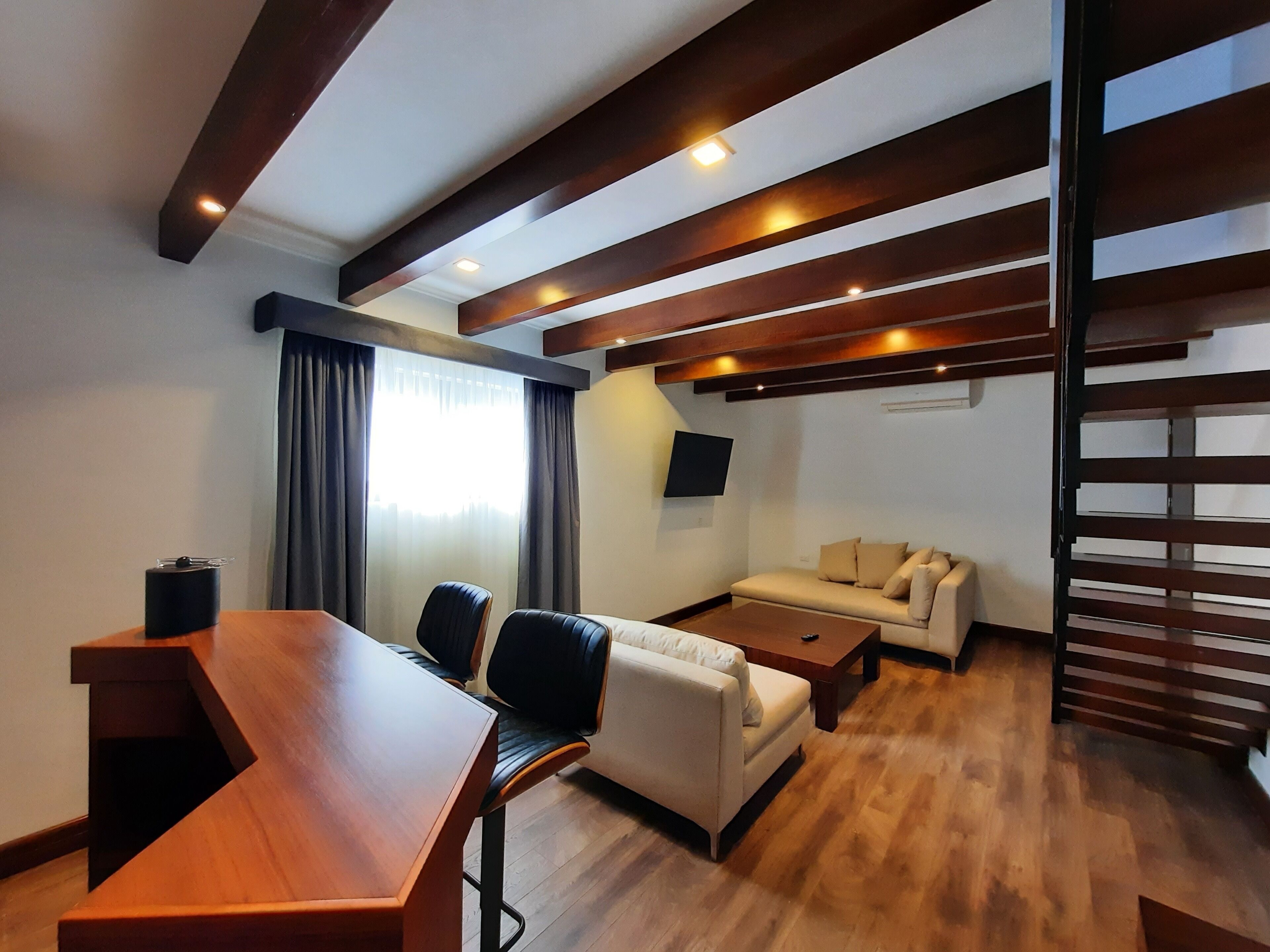 deluxe suite | premium bedding, down duvets, in-room safe, desk