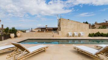 Outdoor pool, open 8:00 AM to 9:00 PM, pool umbrellas, pool loungers