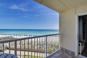 A balcony with a view of the beach and ocean. - Holiday Surf & Racquet 402 2 Bedroom Condo by RedAwning (Destin)