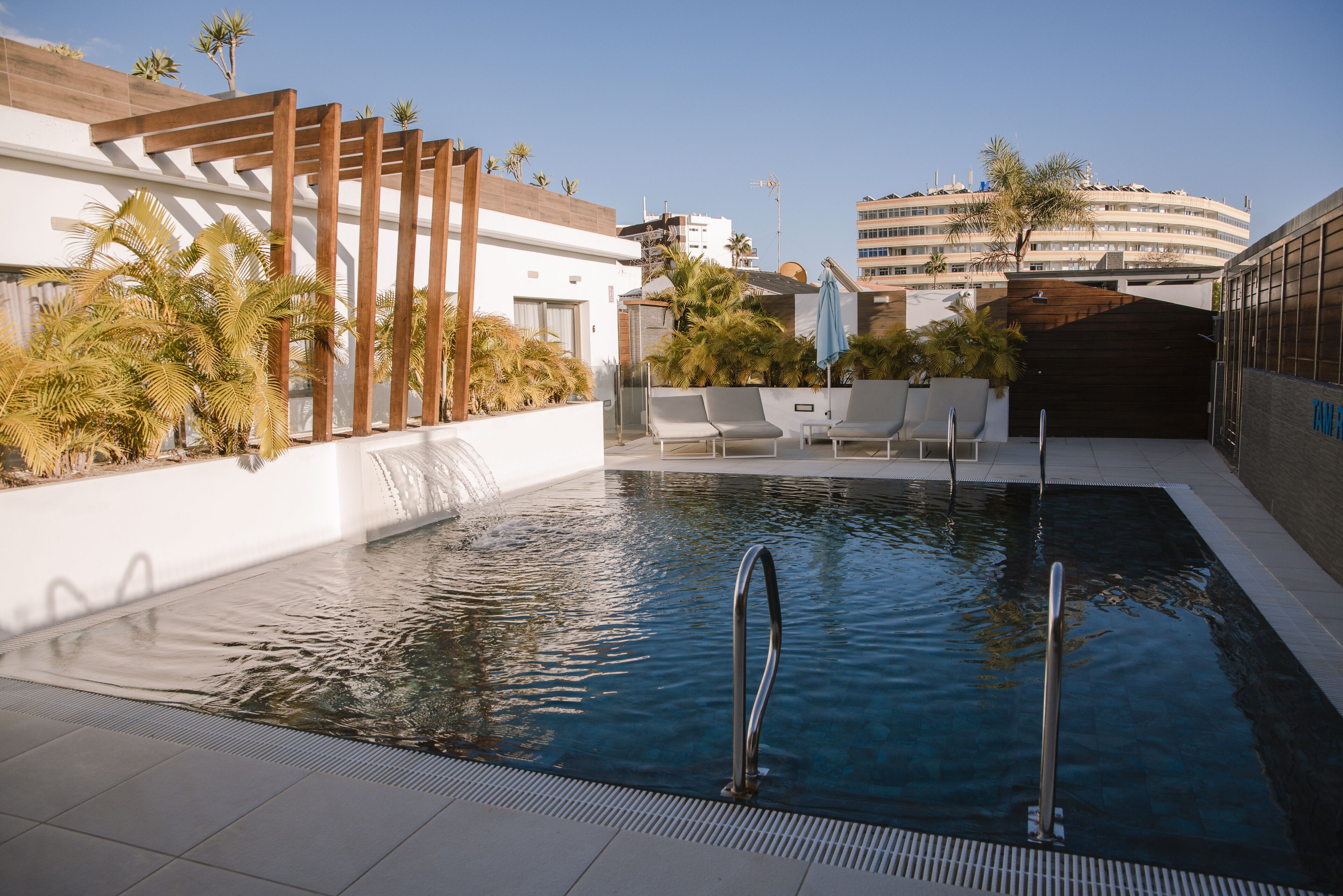 outdoor pool, open 10:00 am to 7:00 pm, pool loungers