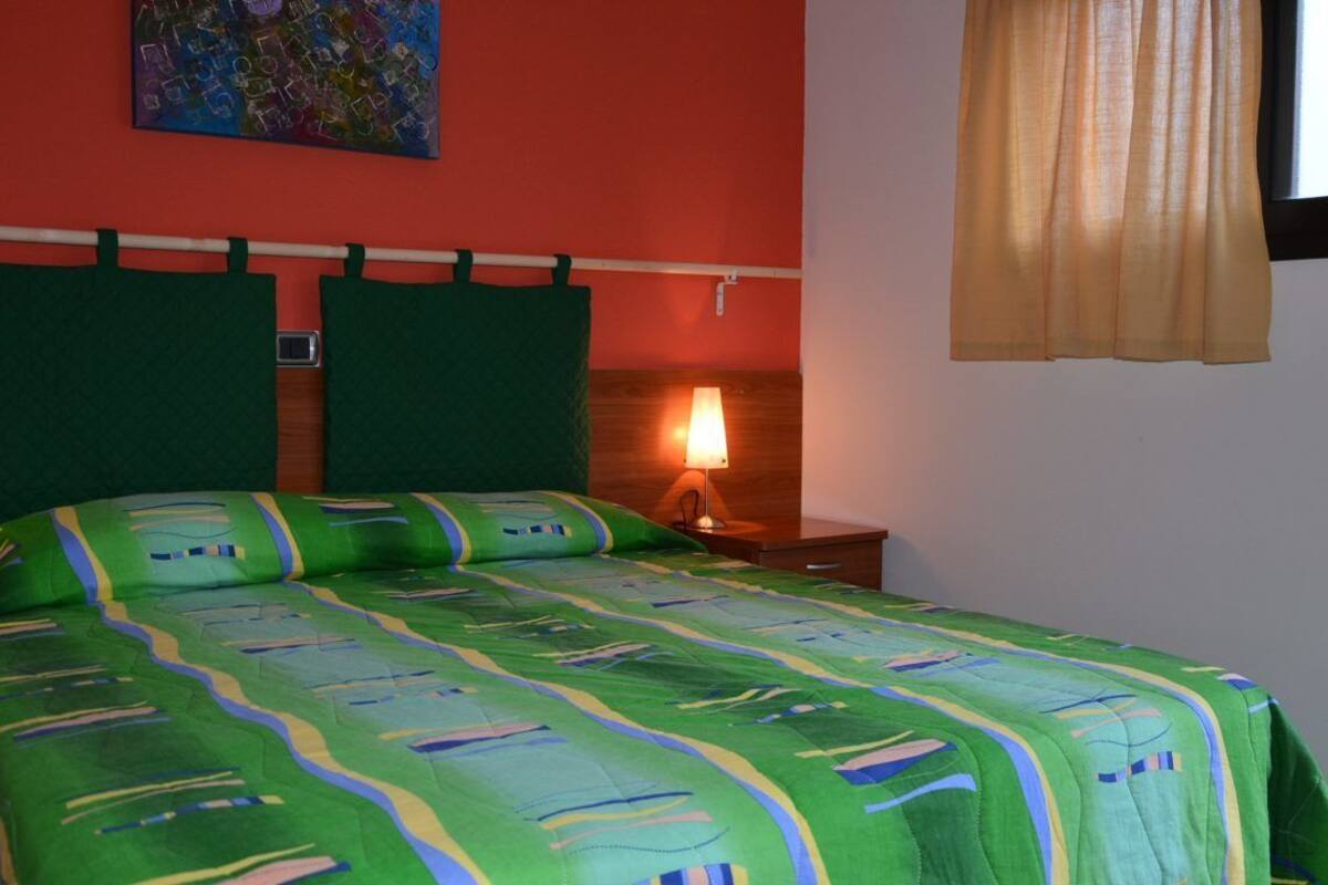 Desk, bed sheets, wheelchair access