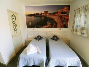 Desk, bed sheets, wheelchair access