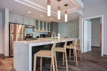 Full-size fridge, microwave, oven, stovetop at Residence Inn by Marriott Myrtle Beach Oceanfront