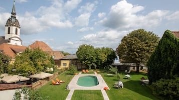Seasonal outdoor pool, pool umbrellas, pool loungers