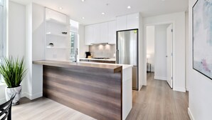Executive Condo, 2 Bedrooms, Hot Tub, City View | Private kitchen | Coffee/tea maker, full-size fridge, microwave, oven - Suite Digs Waterfront Court (Calgary)