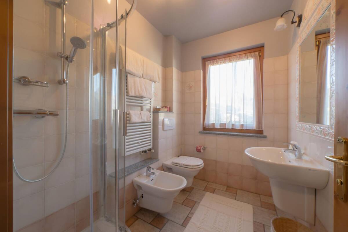 shower, rainfall showerhead, hair dryer, slippers