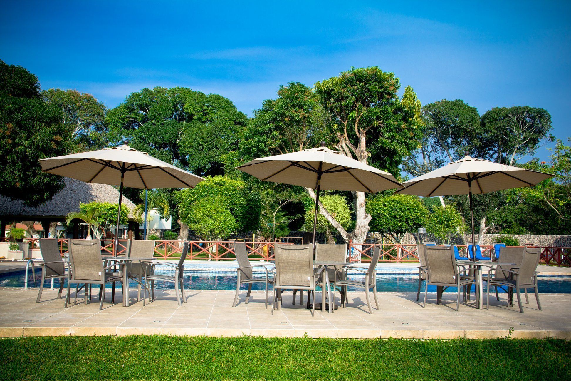 Seasonal outdoor pool, open 9:00 AM to 9:00 PM, pool umbrellas