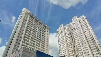 Two high-rise buildings with a clear sky.