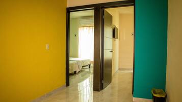 Family Room, 2 Bedrooms, Balcony, City View | Desk, iron/ironing board, free WiFi, bed sheets