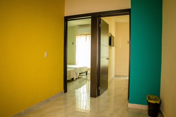 Family Room, 2 Bedrooms, Balcony, City View | Desk, iron/ironing board, free WiFi, bed sheets