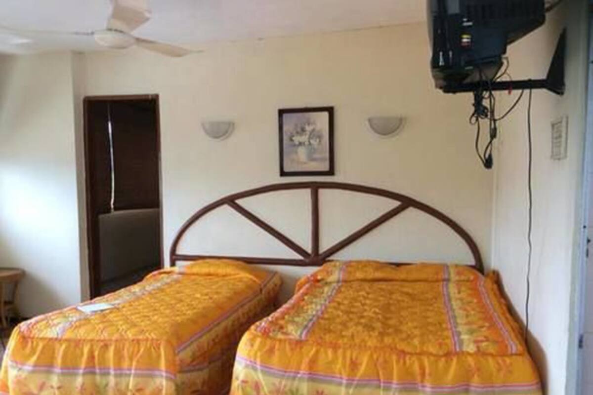 Departamento familiar, varias camas, para fumadores, vista parcial al mar | Wifi gratis y ropa de cama