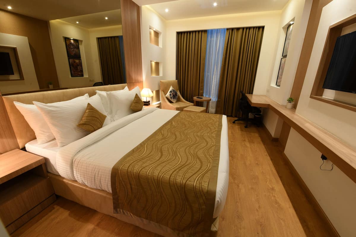 Luxe beddengoed, een minibar, een kluis op de kamer, een bureau