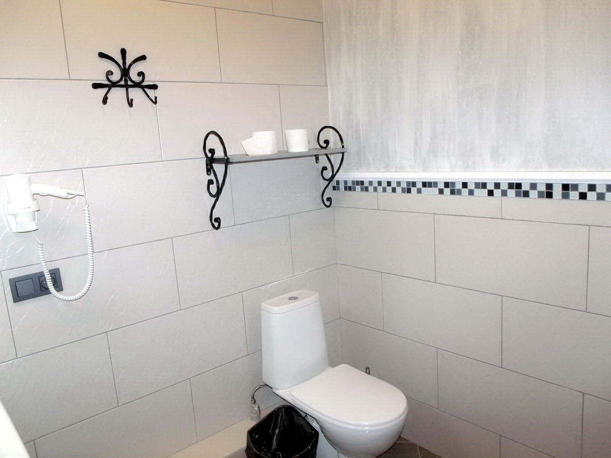 economy double room | bathroom | shower, rainfall showerhead, bathrobes, slippers