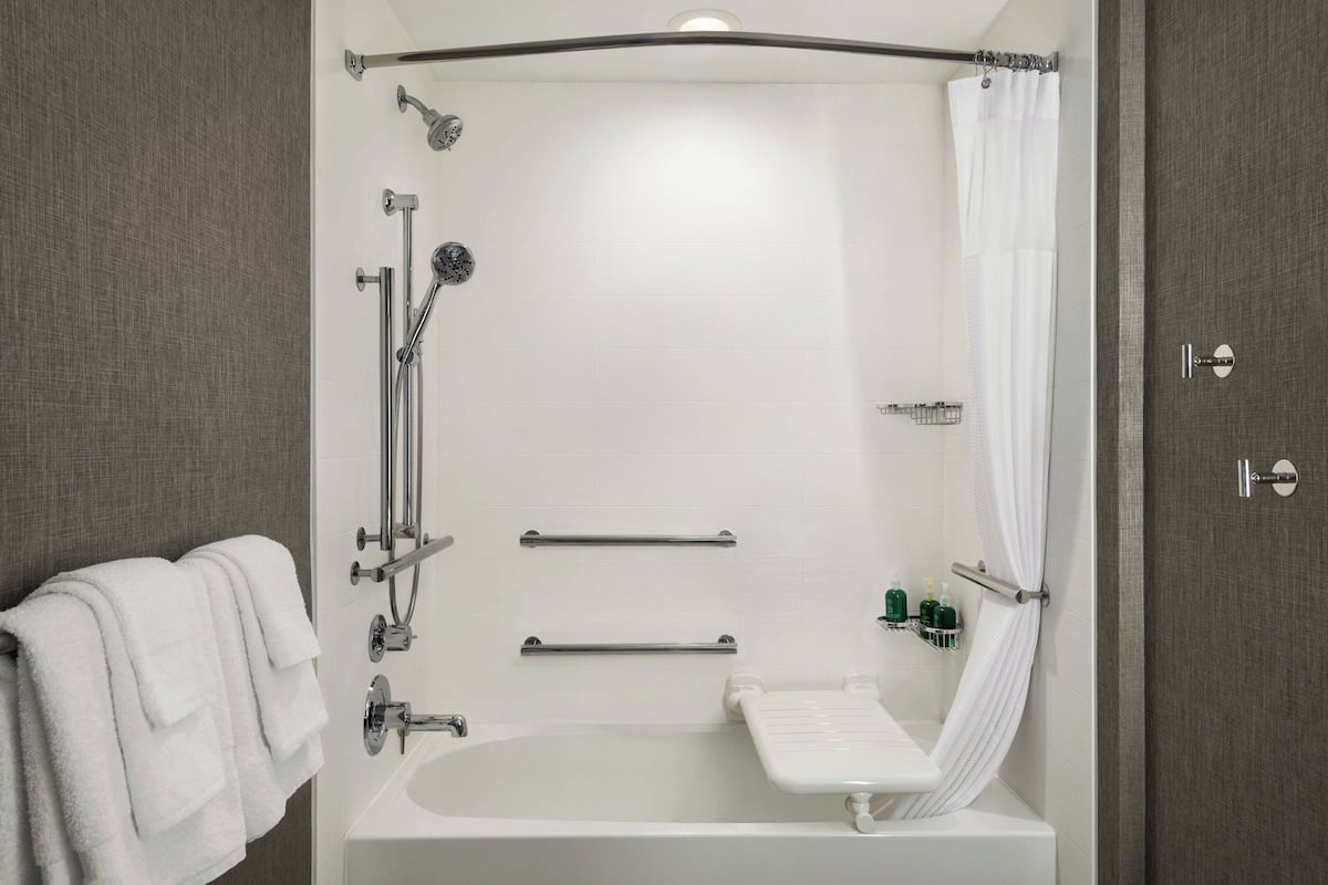 suite, multiple beds, city view | bathroom | free toiletries, hair dryer, towels