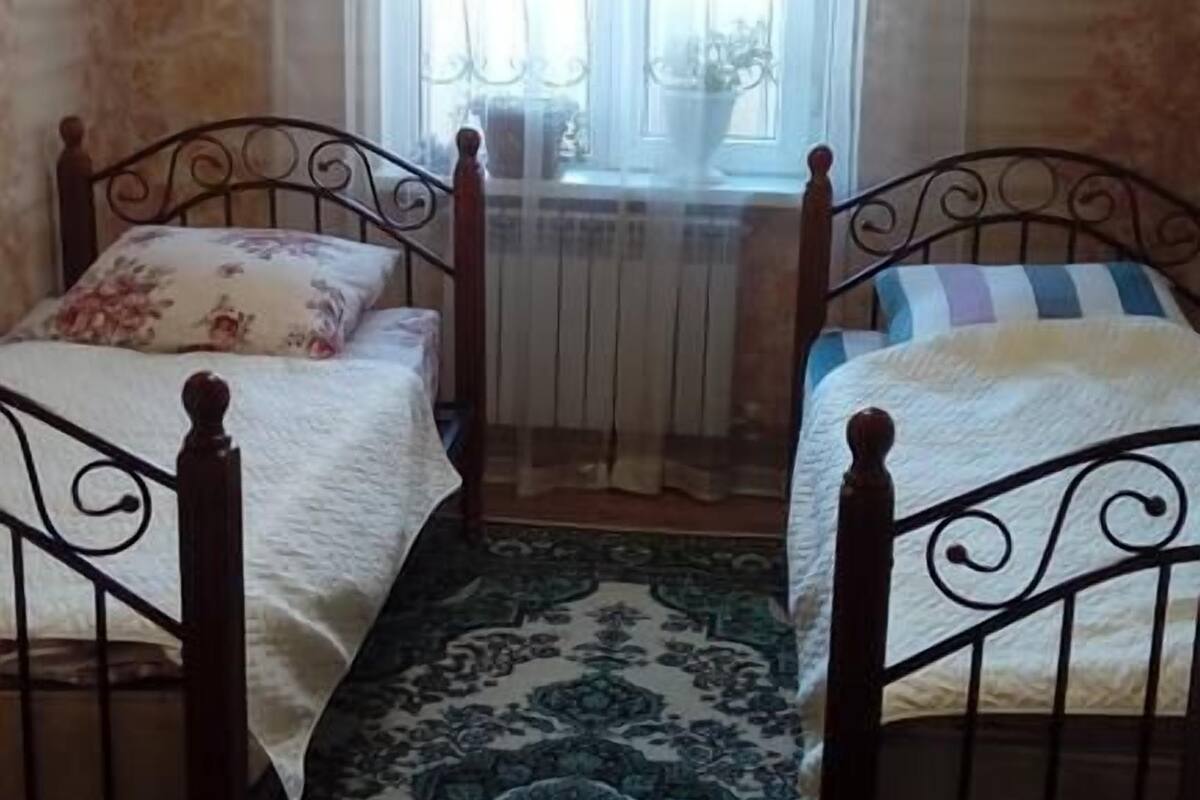 Standard Twin Room | Blackout drapes, iron/ironing board, WiFi (free), bed sheets