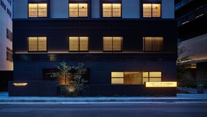 A modern hotel building with multiple illuminated windows and a sign indicating it is the Mitsui Garden Hotel at Kyoto Station. - Mitsui Garden Hotel Kyoto Station (Kyoto)