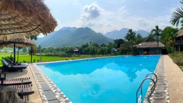 Outdoor pool, pool umbrellas, pool loungers