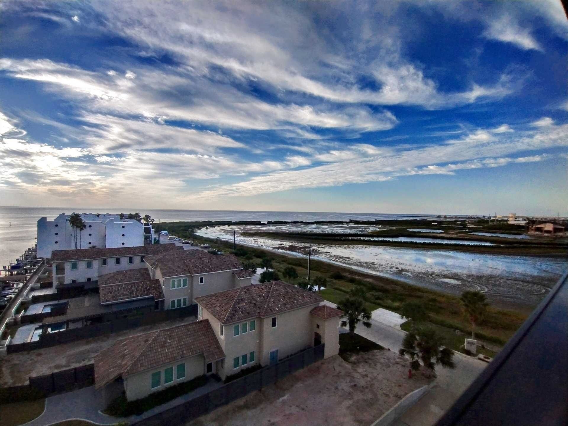 A coastal residential area with houses and a beach.