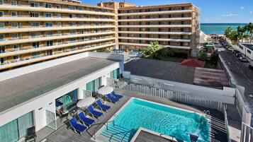 Outdoor pool, open 10:00 AM to 8:00 PM, pool loungers