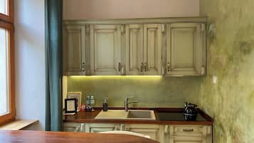 A kitchen with wooden cabinets, a sink, and a countertop.