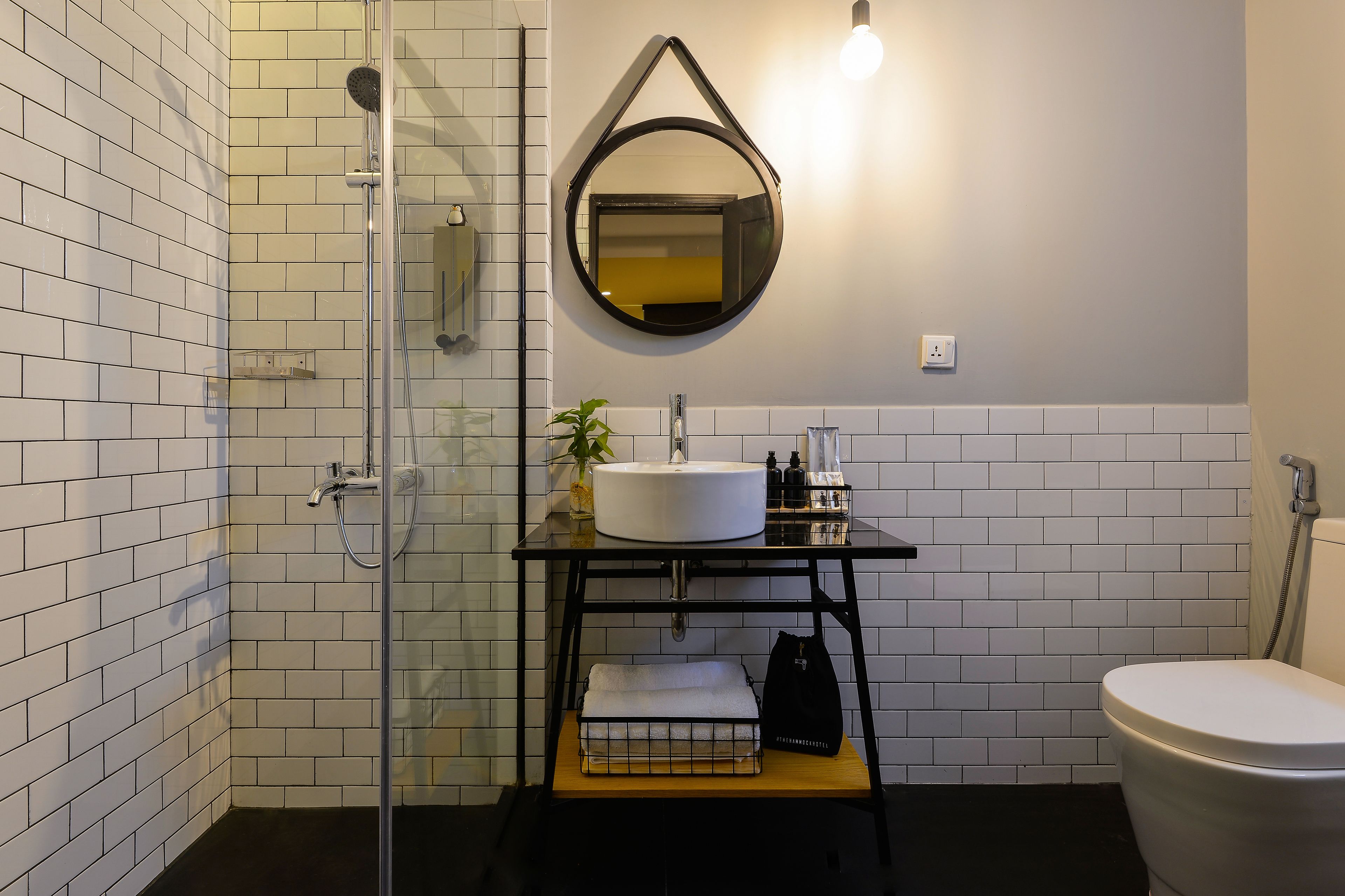 deluxe double nest | bathroom | shower, rainfall showerhead, free toiletries, hair dryer