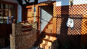 A reception area with a sign reading "RESEPSİYON" and a staircase leading to an upper level. - Kuscu Han Otel (Safranbolu)