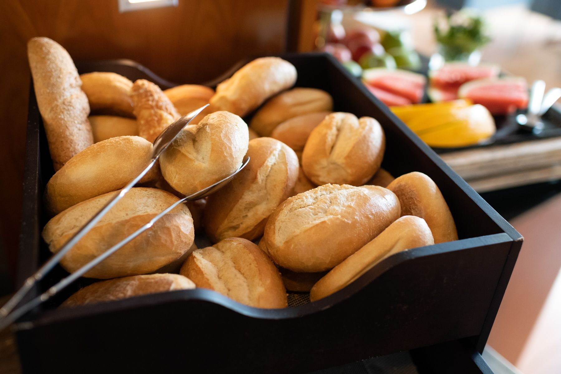 A tray of freshly baked bread rolls.
