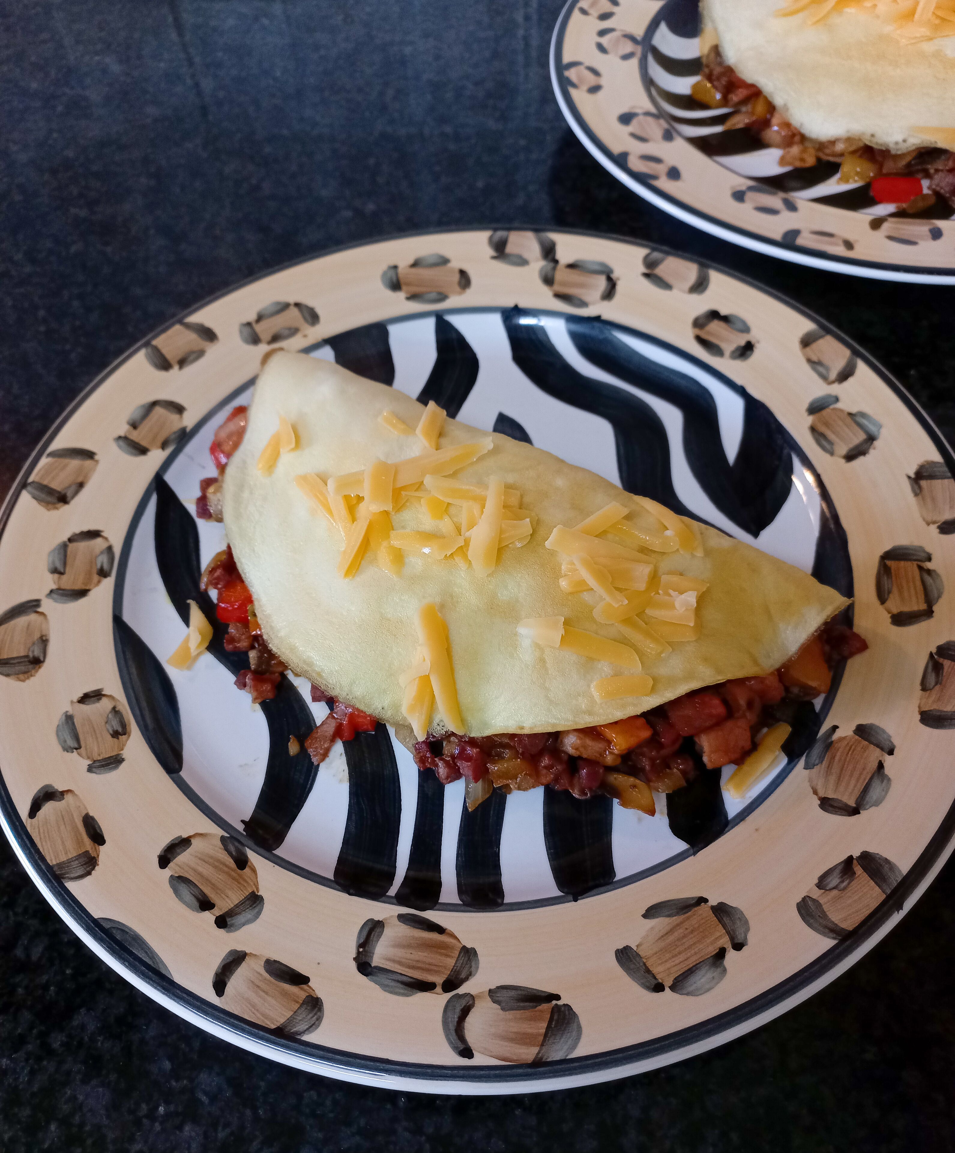 A sandwich on a plate with a patterned design.