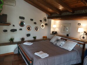 Basic Triple Room, Hill View | Minibar, in-room safe, individually decorated, blackout curtains - La Fattoria dei Nonni Resort dell'Etna (Paterno)