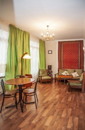 Apartment, 2 Bedrooms | Living room | Flat-screen TV