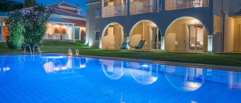 Seasonal outdoor pool, pool umbrellas, pool loungers