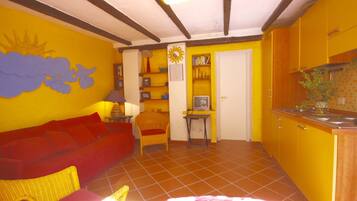 Villa | Living area | Flat-screen TV, fireplace