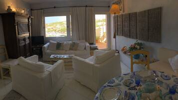 Apartment, 1 Bedroom, Sea View | Living area | Flat-screen TV