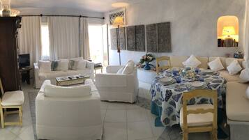 Apartment, 1 Bedroom, Sea View | Living area | Flat-screen TV