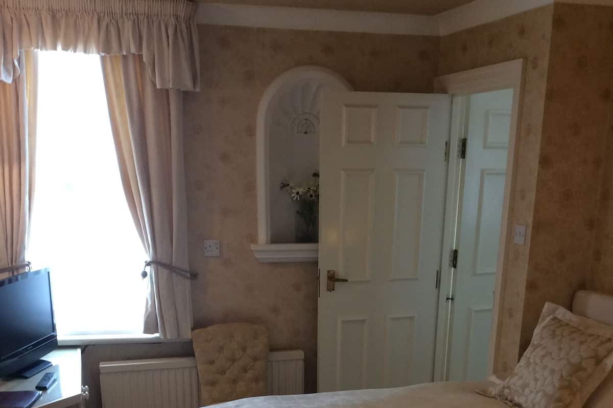 Classic Family Room | Desk, iron/ironing board, bed sheets
