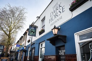 A building with a sign reading "The Dark Horse Freehouse". - The Dark Horse Pub (Bristol)