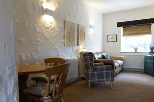 Suíte clássica | Área de estar | TV 32 polegadas com canais digitais