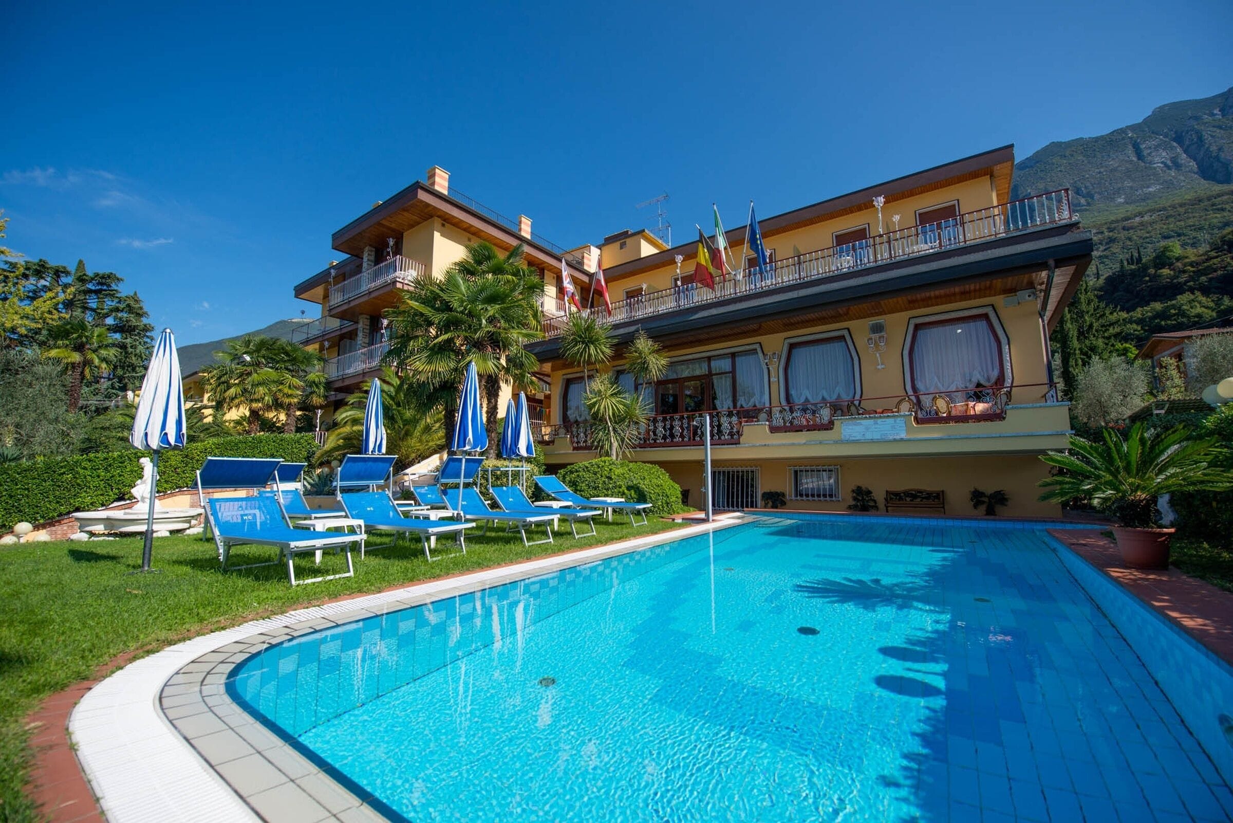 Outdoor pool, open 9:00 AM to 7:00 PM, pool umbrellas, pool loungers