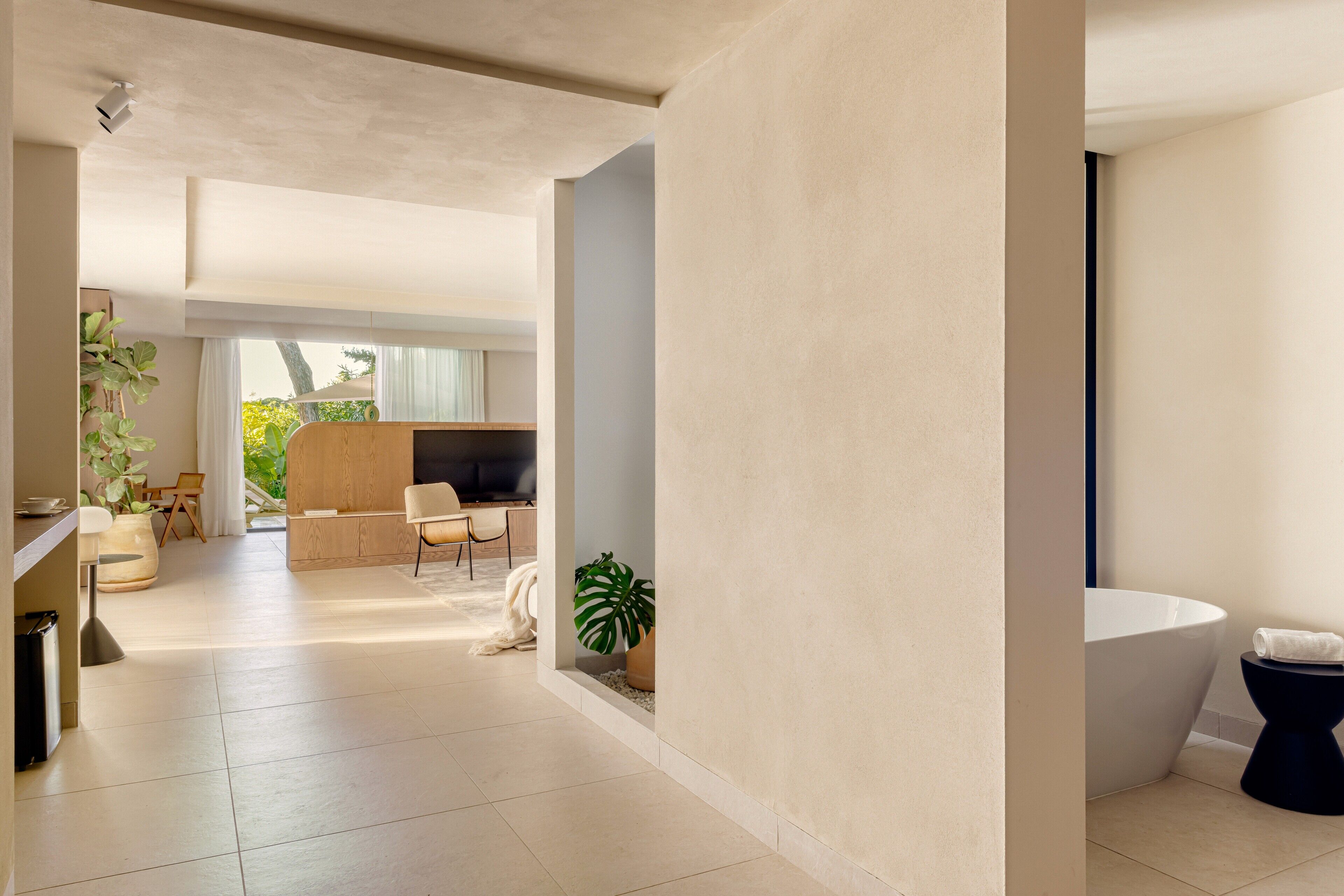 A modern interior with a living area, a kitchen, and a bathroom.