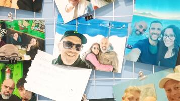 A wall covered with photos and notes, some with text and others with images of people.